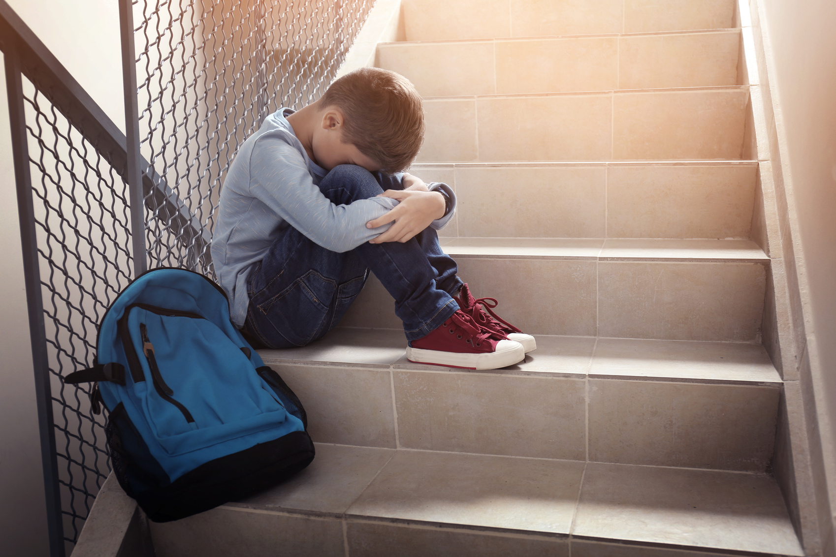 Crying Boy in School Stairs